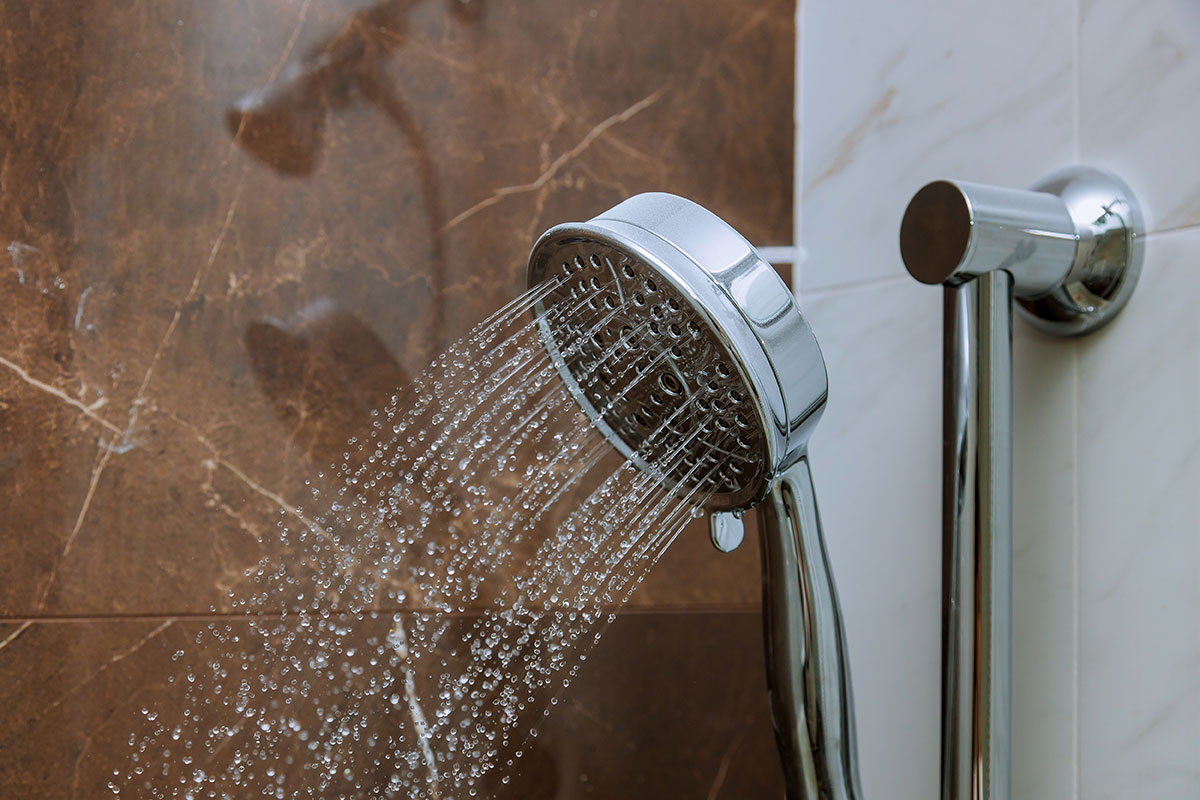 interior of water flowing from shower in the bathroom