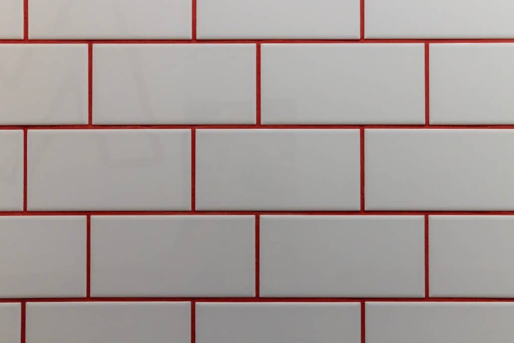 white tiles with red grout