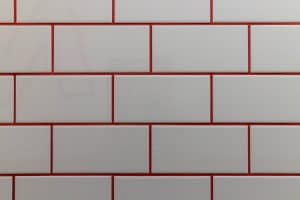 white tiles with red grout