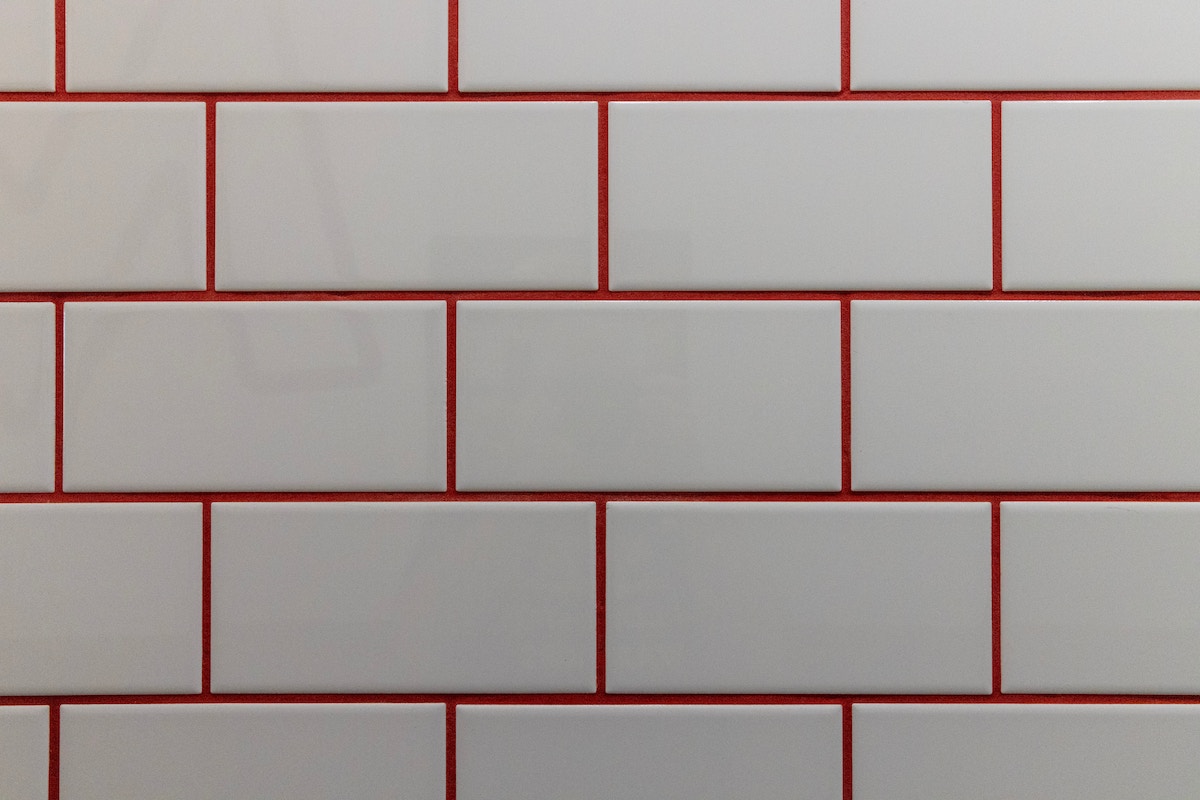 white tiles with red grout