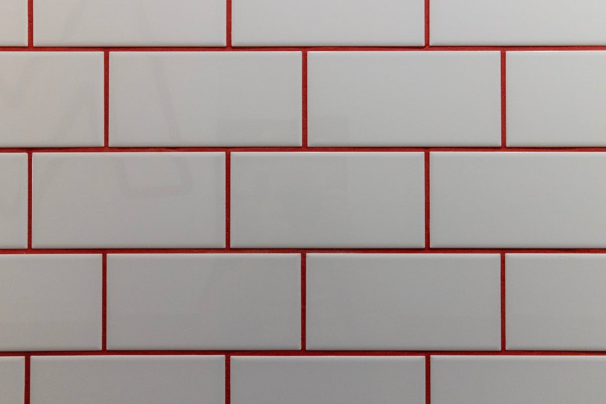 white tiles with red grout