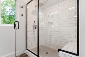 Glass Door in a white tiled Bathroom
